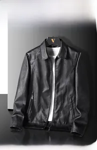 Close-up of black leather jacket featuring a classic collar and smooth metallic zipper