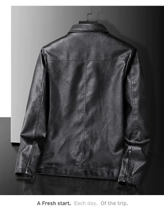 Detail view of black faux leather jacket back with metallic cuff zippers and seam stitching
