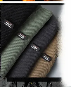 Detail of ribbed knit scarves in four colors featuring embossed Free Spirit leather labels