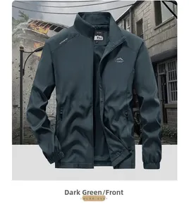 Detail of dark green outdoor jacket featuring stand collar and white chest logo