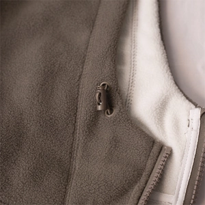 Macro detail of dark brown fleece jacket with white lining and toggle drawstring