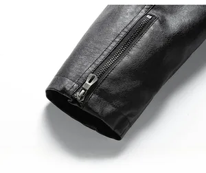Close-up of black leather jacket cuff with metal zipper detail and lychee texture