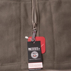 Close-up of durable resin zipper and premium fleece texture on hooded outdoor jacket
