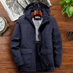 Men's deep blue winter parka with fleece lining and hood on a wooden background