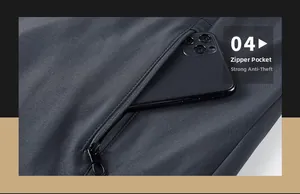 Detail of grey outdoor jacket featuring a secure zipper pocket holding a smartphone
