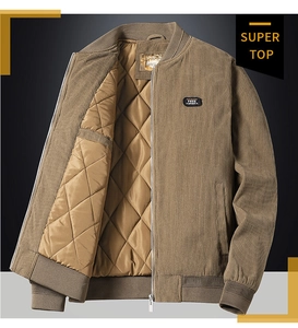 Detail of khaki corduroy bomber jacket featuring diamond quilted lining and rib-knit collar
