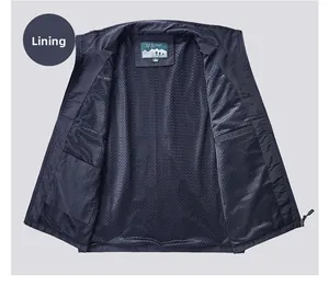 Detail of breathable mesh lining and interior pocket on navy outdoor utility vest
