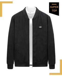 Close-up of black corduroy bomber jacket featuring Free Spirit chest patch and rib trim