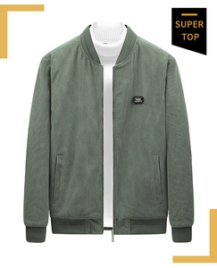 Close-up of dark green corduroy jacket with ribbed cuffs and Free Spirit patch
