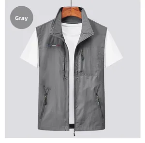 Close-up of grey outdoor vest featuring multiple utility pockets and zip closure