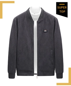 Detail of grey corduroy bomber jacket with baseball collar and Free Spirit patch