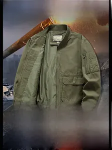 Close-up of military green cotton flight jacket showing zip pockets and rib cuffs