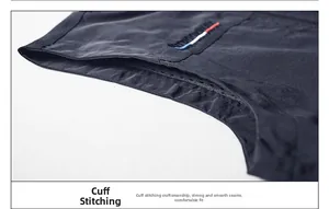 Detailed close-up of durable flat-seam cuffs on a fishing vest with outdoor embroidery