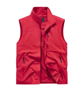Detail view of red quick-dry fishing vest showing zipper pockets and breathable mesh lining