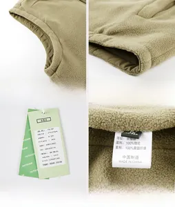 Detail view of khaki fleece vest with flat stitching, size tags and wash instructions