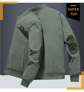 Close-up of green corduroy jacket with elbow patches and ribbed cuffs detail