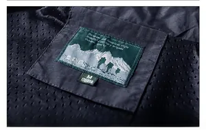 Detail of multi-pocket fishing vest neckline with size M label and breathable mesh lining