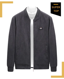 Detail of grey corduroy bomber jacket with baseball collar and Free Spirit patch