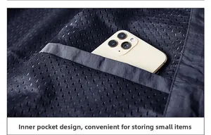 Detail view of the breathable mesh inner pocket with functional smartphone storage space