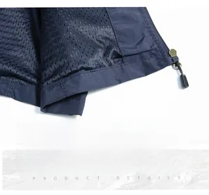 Dettaglio dell'orlo del gilet outdoor con tessuto resistente, fodera a rete e cuciture