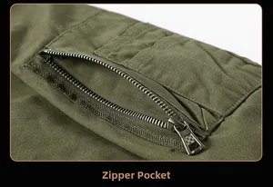 Macro detail of high-quality metal zipper pocket on army green cotton canvas jacket