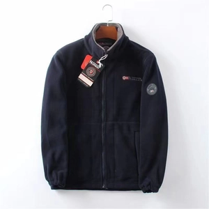 Detail view of navy fleece jacket with Norway flag embroidery and full-length zipper