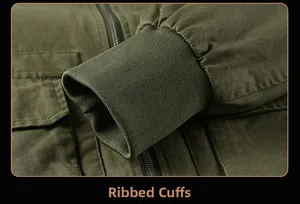 Detailed view of elastic ribbed cuffs and durable cotton fabric on military green jacket