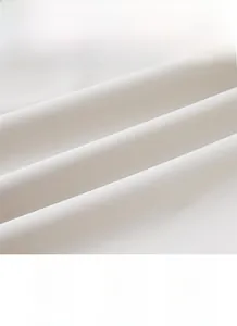 Macro shot of breathable white windbreaker fabric texture showing soft drape and weave
