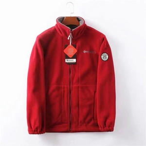 Detail of red fleece jacket featuring Norway chest embroidery and high-quality zipper