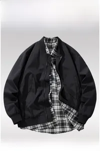 Front detail of men's black windproof bomber jacket with knitted cuffs and zipper