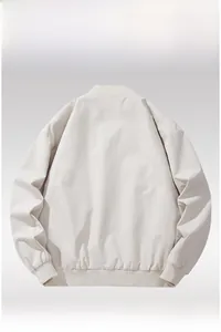 Back view of a cream-colored windbreaker jacket with ribbed collar and elastic hem details