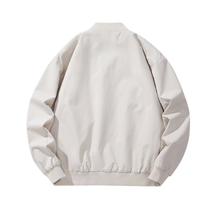 Minimalist beige bomber jacket for men and women showing the plain back design view