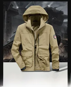 Detail of khaki outdoor hooded tactical jacket with zip chest pocket and utility arm patch