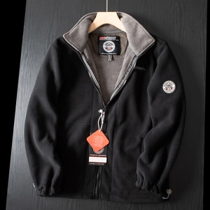 Detail of black fleece jacket with grey lining, Norway expedition logo and sleeve patch