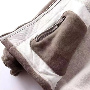 Detailed close-up of double-sided polar fleece jacket with zippered mesh inner pocket