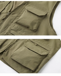 Close-up of army green tactical vest showing multi-pocket design and breathable mesh lining