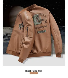 Detailed embroidery on back of warm brown leather bomber jacket with moon background