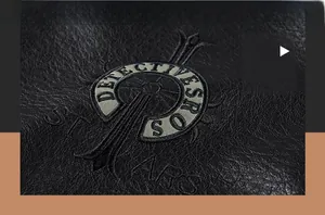 Close-up of leather jacket showing premium texture and cross embroidery detail