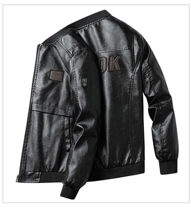 Detail of black PU leather jacket featuring large DK letter embroidery on the back