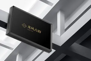 Detail of a modern black side-mounted metal light box sign on a white geometric wall