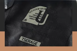 Detail of street style black leather jacket with SOUADOF SECRET DETECTIVES back embroidery