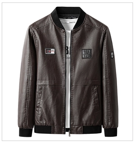 Detail view of brown faux leather biker jacket with chest patches and baseball collar