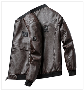 Detail of dark brown faux leather jacket with rib-knit collar and 'K' patch on back