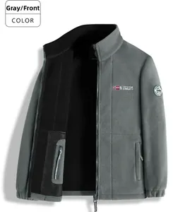 Detail of gray outdoor fleece jacket showing mesh inner pocket and logo embroidery