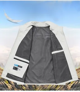 Detail of light grey outdoor vest with breathable black mesh lining and internal zip pocket