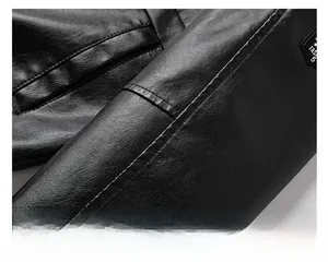 Close-up of black leather jacket with lychee texture, stitching and FASH label