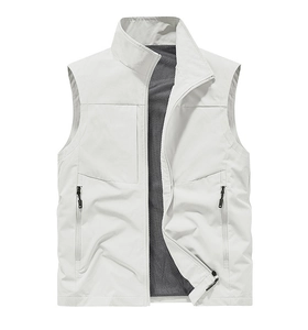 Detail of light grey outdoor vest featuring breathable black mesh lining and zip pockets