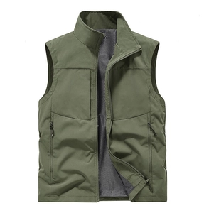 Detail of army green tactical vest with breathable mesh lining and zip pocket