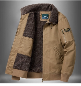 Detail of khaki cotton work jacket featuring warm brown lamb wool lining and outdoor badge