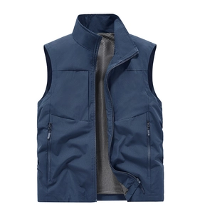 Detail of blue outdoor vest showing breathable mesh lining and secure zipper pocket